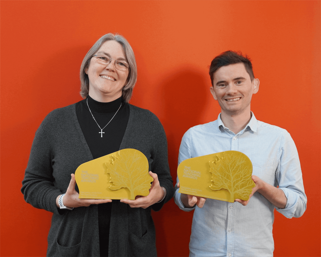 Jo Fison and Matt Jenkins holding their Golden National Pearson's Awards